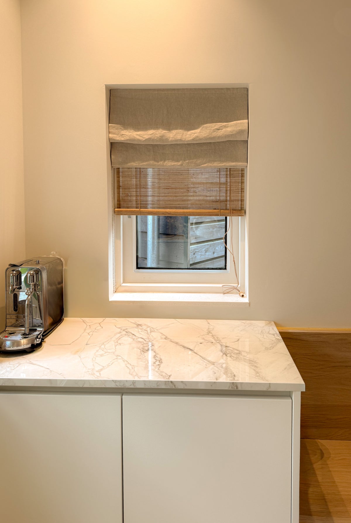 Oatmeal Baltex linen roller blind from Tuamoto collection by BALTEX BLINDS, showcasing elegant fabric and sleek design.
