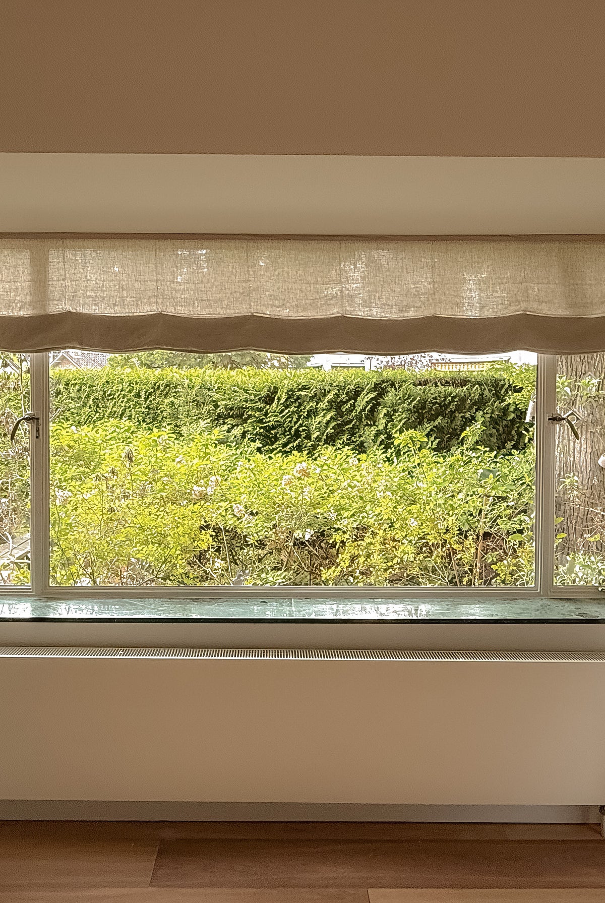 Baltex linen pleated roller blind without battens from BALTEX BLINDS, shown as a folded fabric window covering.