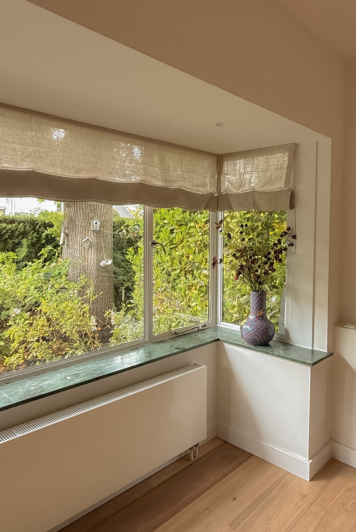 Baltex linen roller blind without battens from BALTEX BLINDS, showcasing a light, textured fabric window covering.